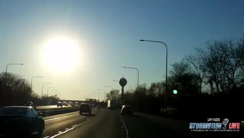 Driving into the warm sunset on a cold evening in northern Illinois